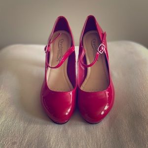 CityClassified red heels size 7 (women’s, US).